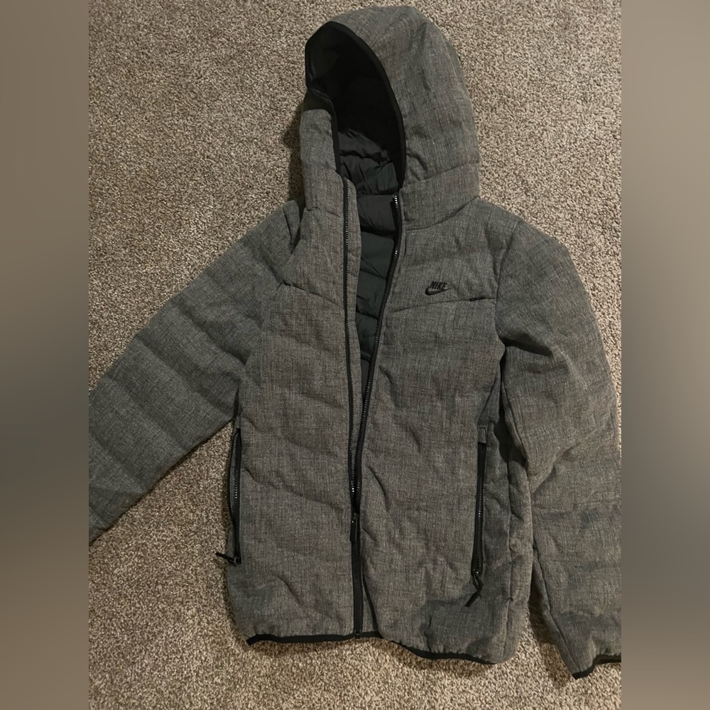 Nike Xs, very nice and warm jacket. Used but great condition